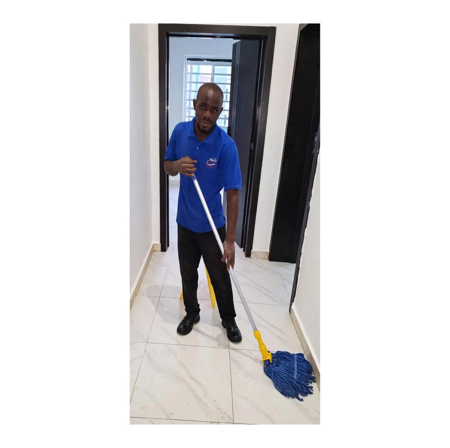 Nigerian Male Cleaner Floor Mopping - Tino Klin