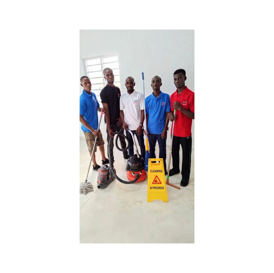 Nigerian Cleaner Scrubbing Kitchen Tiles - Tino Klin